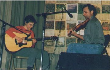 Monica Andis (guitar) and Larry Spisak (fiddle)